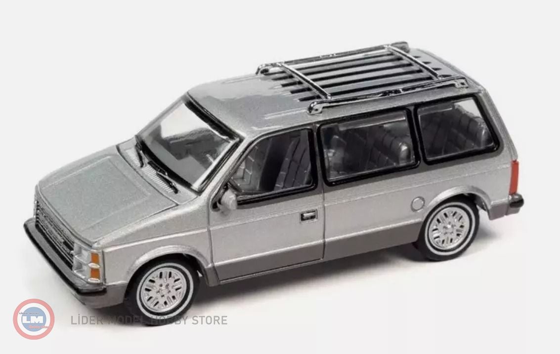 1:64 AutoWorld 1985 Plymouth Voyager (Radiant Silver Metallic with Charcoal Lower Sides)