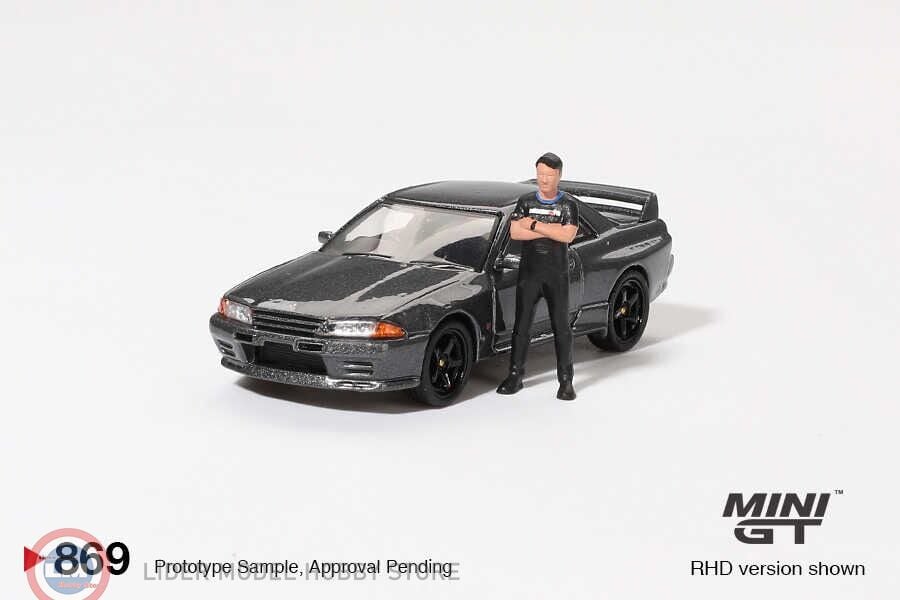 1:64 Mini GT 1992 Nissan SKYLINE GT-R (R32) NISMO NISMO GUNMETAL WITH TSUGIO MATSUDA FIGURE