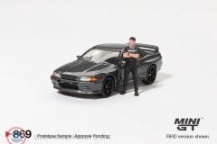 1:64 Mini GT 1992 Nissan SKYLINE GT-R (R32) NISMO NISMO GUNMETAL WITH TSUGIO MATSUDA FIGURE