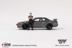 1:64 Mini GT 1992 Nissan SKYLINE GT-R (R32) NISMO NISMO GUNMETAL WITH TSUGIO MATSUDA FIGURE