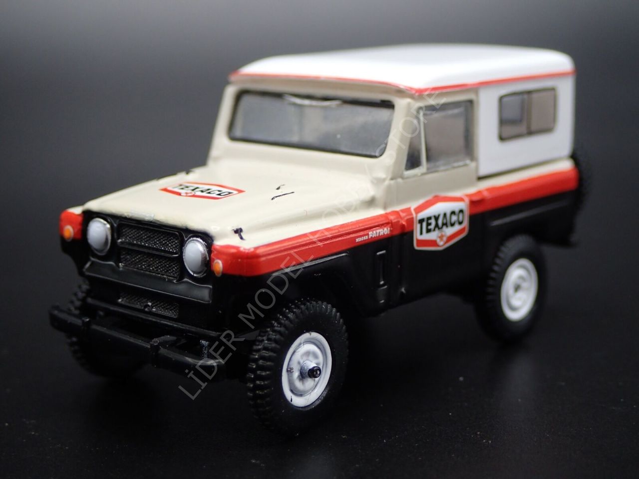 1:64 1967 Nissan Patrol Texaco The Hobby Shop Serisi